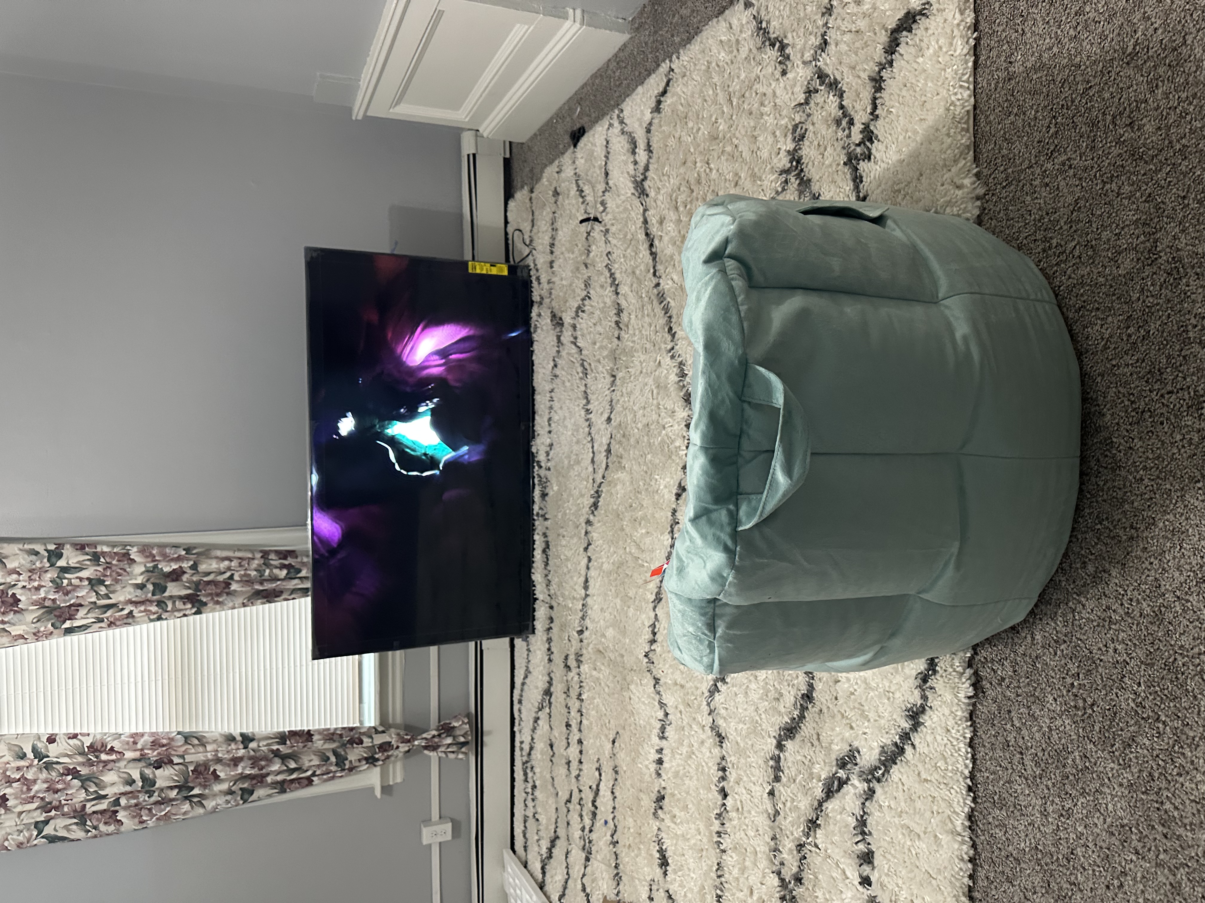 The bean bag chair and television in Omar’s apartment, described in his story.